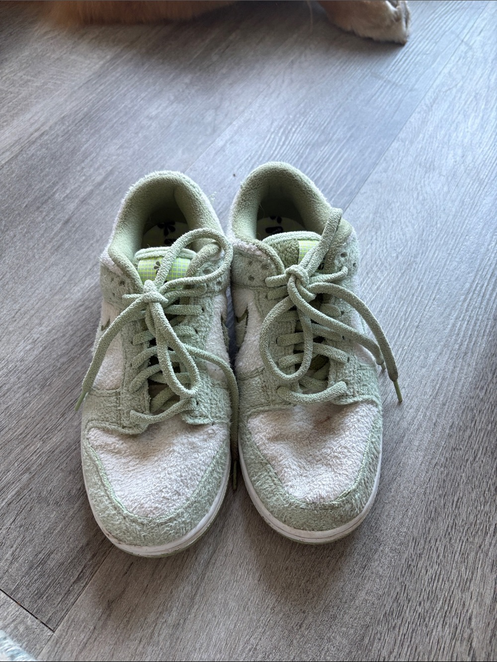 Green and white Nike Dunk sneakers